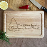 Personalised Christmas chopping board, engraved with a festive design featuring a Christmas tree and the words "The Wilson Family, Christmas Cheese Board".