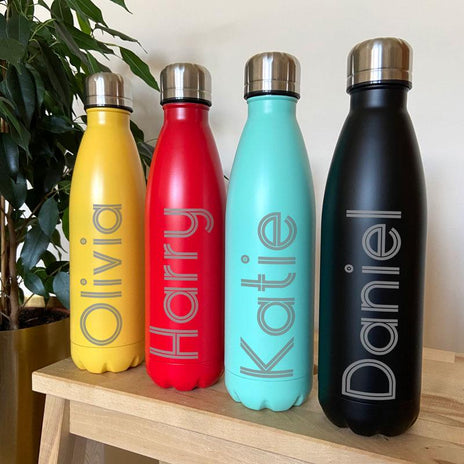 A range of vibrantly coloured water bottles with custom engraving
