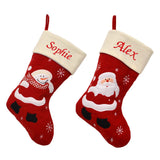 Ivory topped red Christmas stockings with custom first name