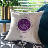 A personalised jubilee cushion with a linen cover and printed platinum jubilee emblem.