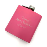 A personalised hip flask with a mat pink coating and an engraved message.