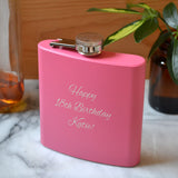 A personalised pink hip flask with the message "Happy 18th Birthday" engraved on the front.