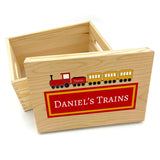 A personalised toy box with a red and yellow train printed on the lid. 