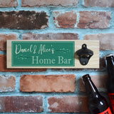 A personalised wooden home bar sign with a wall mounted bottle opener. The custom design is printed in teal and white