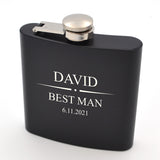 Personalised 6oz black hip flask pictured with a special design engraved, ideal for weddings or corporate events.