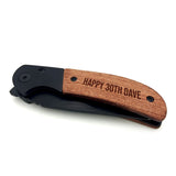 A short messaged engraved on to the pocket knife with the blade closed.