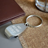 A personalised metal bottle opener keyring with a brushed steel finish