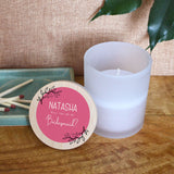 A personalised bridesmaid candle in a glass jar with a bamboo lid. The lid has a printed design which says "Will you be my Bridesmaid?" 