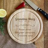 Round wooden chopping board engraved with speciality dishes