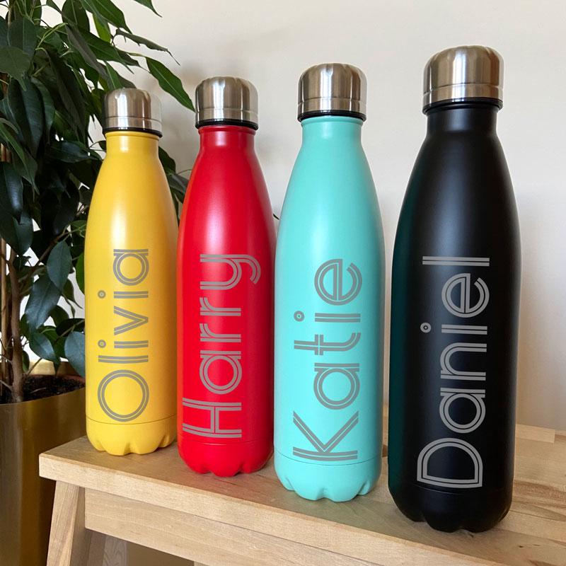 A range of vibrantly coloured water bottles with custom engraving
