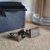 Personalised black wedding cufflinks with a polished finished. The cufflinks are engraved with a name, role and date.
