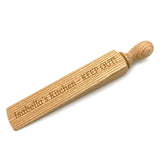 A personalised wooden door stop which can have any message engraved on it