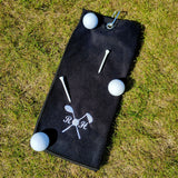 A personalised golf towel in black with three golf balls and two golf tees. 