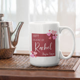 A large personalised Valentine’s Day mug on a wooden tray. The mug is white with a dark red design printed on the front and back. The design features white lettering on a dark pink background with light pink hearts spilling over the edge.