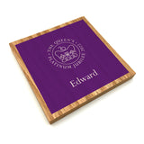 A personalised oak coaster with the official emblem for the Queen's Platinum Jubilee 2022 printed on the front in purple