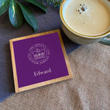 A personalised oak coaster with the official emblem for the Queen's Platinum Jubilee 2022 printed on the front in purple