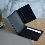 The inside of the black leather wallet showing 8 card slots. 