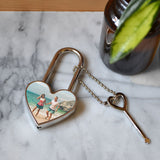 A personalised metal padlock in a heart shape with a photo of a couple printed on it.