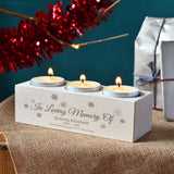 In Loving Memory candle holder pictured with 3 lit tealights in a festive scene.