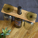 A personalised wine bottle holder with names engraved on either side.