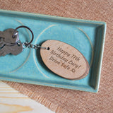  An oval tree shaped keyring with a personalised message engraved on the front. The message is engraved in an italic font.